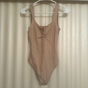 Tan body suit